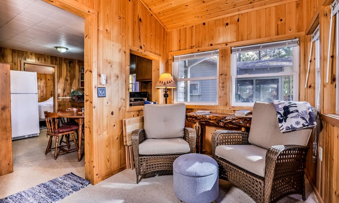 Three Lakes Casa | Charming, dog-friendly, lakefront cottage with boat dock, grill, & firepit