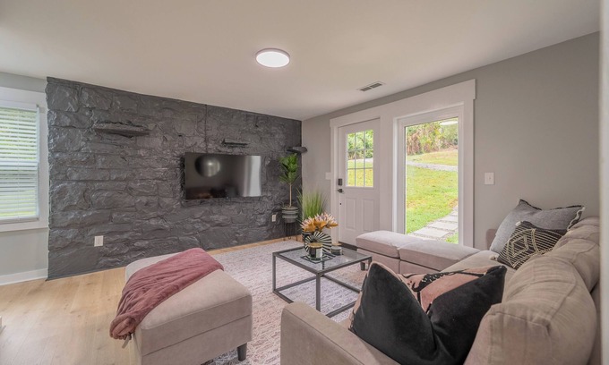 Blacksburg Casa | Charming entry and spacious back deck surrounded by nature, perfect for a peaceful getaway.
