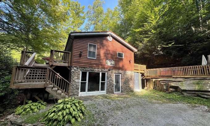 Elkins Casa | Charming riverfront home with beautiful views, hot tub and game room. Fishing!