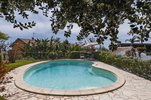 Picanello-Ognina-Barriera-Canalicchio Apartamento | City Cottage with Garden & Pool by Wonderful Italy