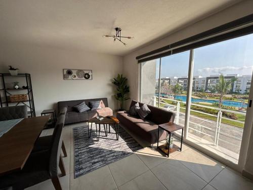 Área del bulevar Barra Vieja Apartamento | Club de Playa, Alberca y Amenidades - Departamento E4