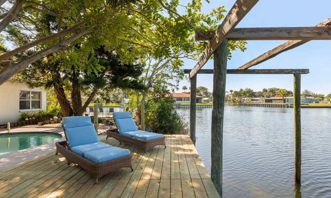 River Isles Casa | Coconut cove - peaceful garden retreat with HEATED pool on canal near the beach!