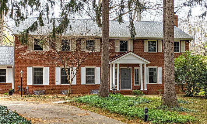 Benton Harbor Casa | Colonial style 5BR/5BA home tucked in a private, wooded setting w/pool & hot tub