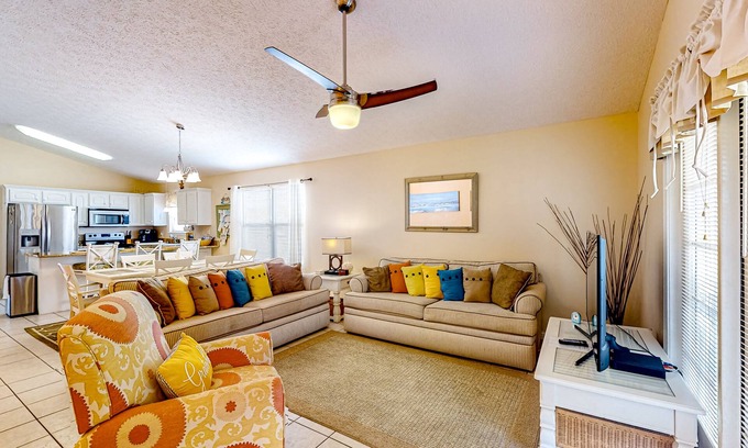 Panama City Beach Cabaña | Colorful home near the beach with 2 pools, bikes, beach gear, W/D, & AC