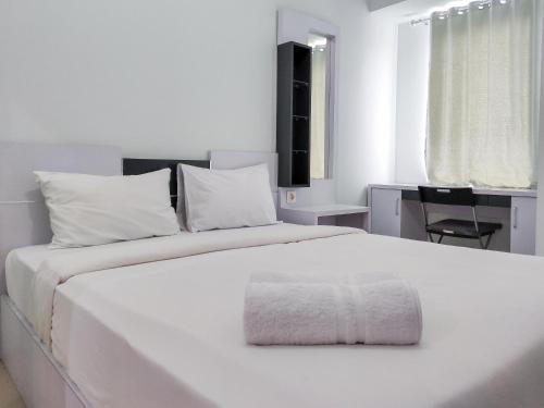 Karawang Apartamento | Compact and Cozy Tamansari Mahogany Studio Apartment By Travelio