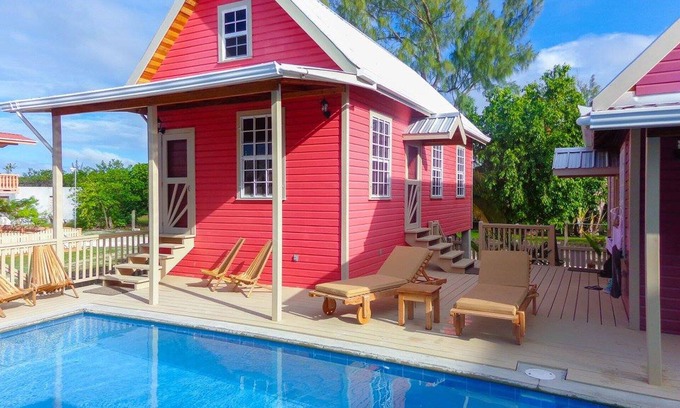 Cayo Corker Cabaña | Coral Cottage en Low Caye Cottages 1 de 4 grandes cabañas
