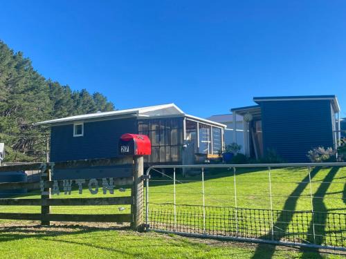 Kawhia Casa | Cosy Aotea Harbour Cottage - water views