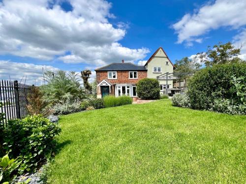 Layer Marney Casa | Cosy Coastal 2-Bedroom Cottage with Hot Tub and Log Burner