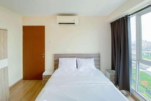Kayu Putih Apartamento | Cozy and Enjoy Living 2BR Tifolia Apartment By Travelio