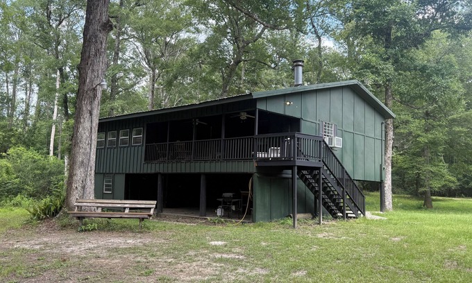 Fluker Cabina | Cozy Camp w/ fire pit, grill and waterfront view of river. Pet Friendly!
