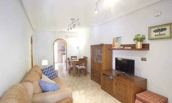 La Marina Apartamento | Acogedor apartamento familiar con patio y terraza y piscina comunitaria