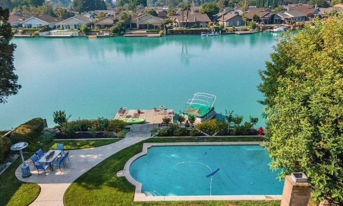 Stockton Casa | Cozy Home on a Lake and a sparkling pool with lush garden and Dock!