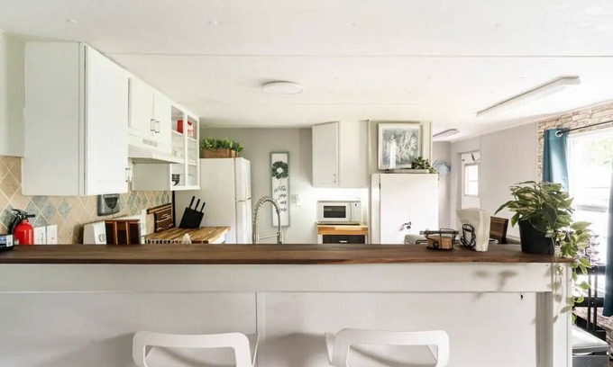 Danville Casa | Cozy home with butcher block counter tops, custom live-edge walnut bar top