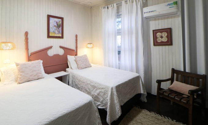 La Cruz Casa | Cozy hotel-style suite with private bathroom, on-site dining, & fast WiFi