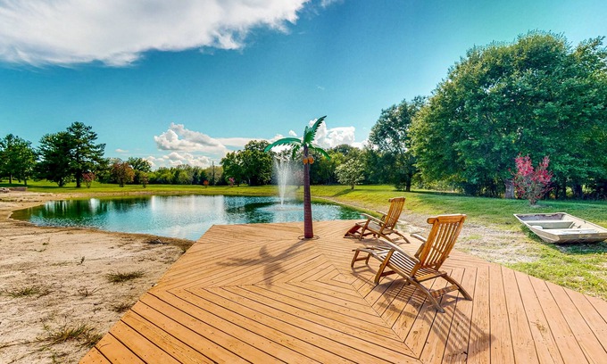 Waller Casa | Custom home with guesthouse, pond, sunning deck, beach & tropical bar