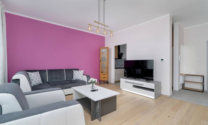 Stare Miasto District Apartamento | Dark Grey and Pink Apartment by Renters