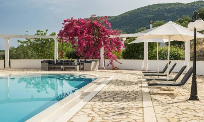 Doukades Villa | Dazzling Corfu Villa | Villa Gwaihir | 7 Bedrooms | Spacious Sun Terrace Fitted with Sunbeds and Parasols | Private Outdoor Swimming Pool | Shaded Terrace wth Outdoor Dining Area | BBQ facilities | Doukádes