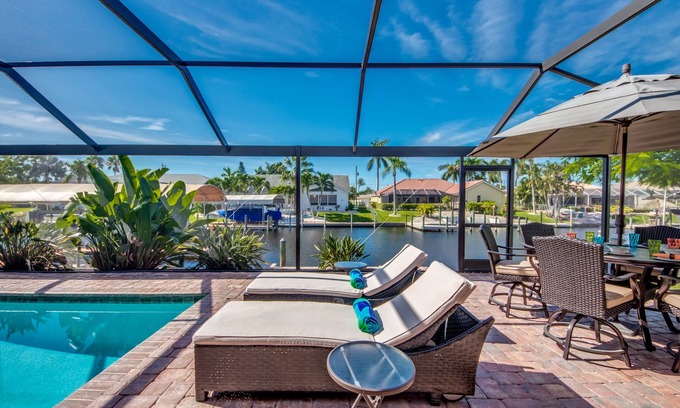 Pelican Villa | Delightful 3 BR waterfront Villa w. heated pool/ dock/ boat lift/ fishing poles