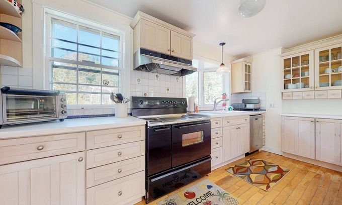 Jamaica Casa | Delightful updated farmhouse with original features, patio, and & W/D