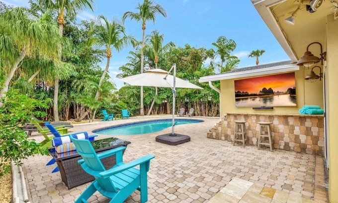 Florida North Atlantic Coast Casa | Discover the ultimate getaway at our stylish 3-bedroom retreat featuring 7 cozy beds, 2 modern bathrooms, a private pool, hot tub (extra fee), outdoor TV, BBQ grill, and a refreshing outdoor shower—your perfect blend of comfort, relaxation, and fun.