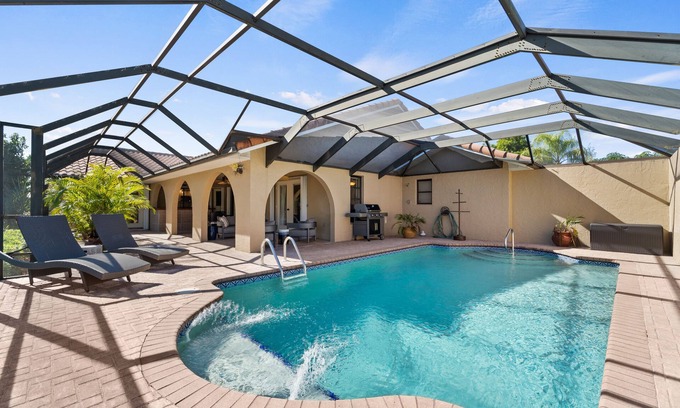 Burnt Store Isles Casa | Dog-Friendly Canal-Front Home with Heated Pool, Dock, Screened Lanai & Free WiFi