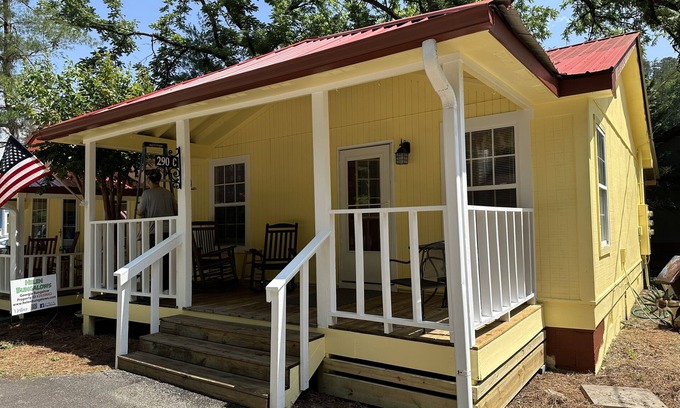Helen Cabaña | Downtown by Chattahoochee River, sit on front porch as horse and buggy stroll by