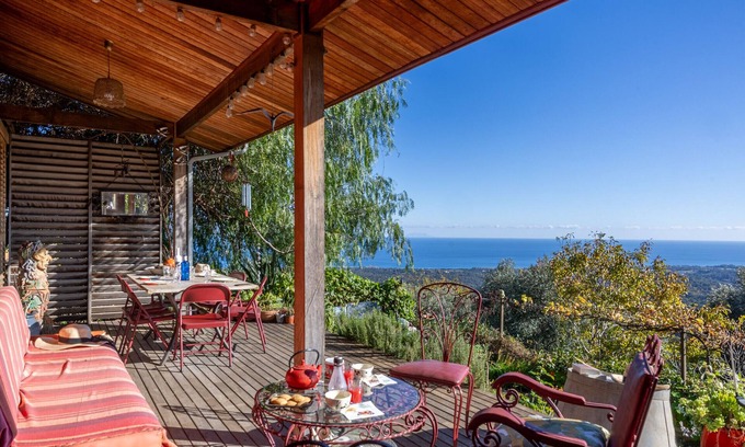 Valle-de-Campoloro Casa | E Tre Petre wooden house with magnificent sea views and a large garden planted with trees