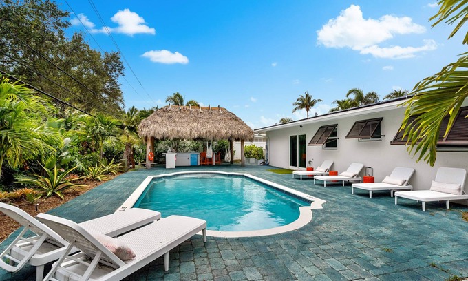 Garden Isles Casa | Eccentric home with pool, tiki hut & outdoor kitchen