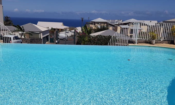 Carosse Apartamento | EDEN APPT, T2 de pie 4 personas, piscina, vista al mar, St Gilles