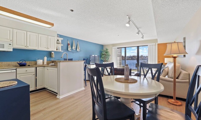 Charlevoix Condominio | Edgewater Inn Condo #117D with Waterfront Access | Pool, Hot Tub, Sauna