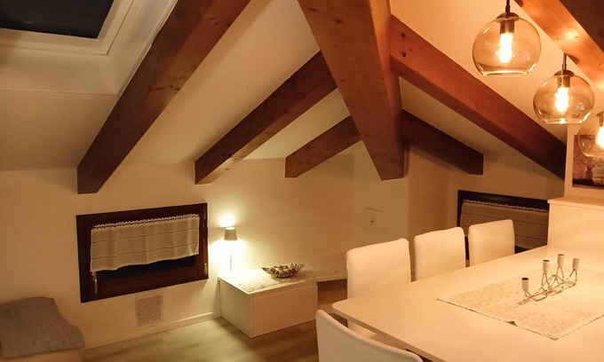 Levico Terme Apartamento | Elegant attic with Dolomites view, relaxation and nature in Levico Terme.