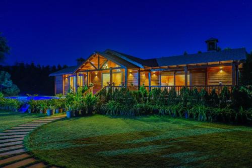Dubbi Villa | ELIVAAS Riveira Hills - 3 BHK Wooden Cottage with Lush Garden, Pvt Pool