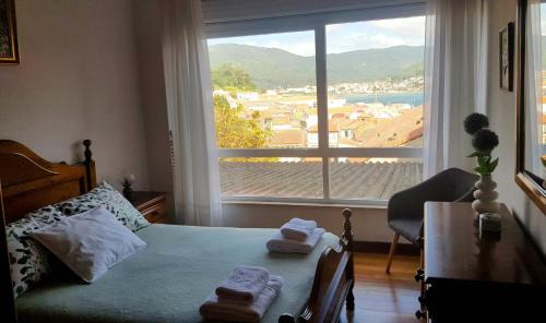 Muros Apartamento | En Muros, céntrico, amplio, luminoso, vistas al mar