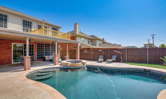 Rowlett Casa | Enjoy the peace and quiet back patio with Lagoon pool.