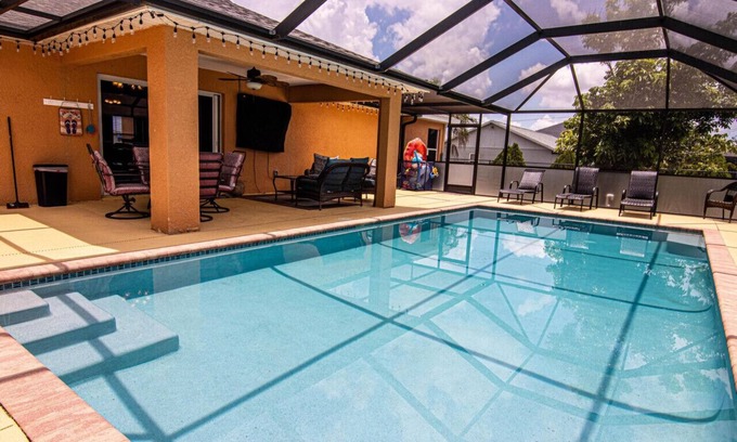 Diplomat Casa | Enjoy the Salt Life with this Heated Saltwater Pool and outdoor lanai.