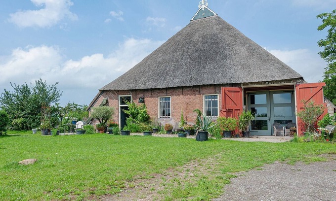 Burum Apartamento | Casa rural en Lauwers con barco de remos