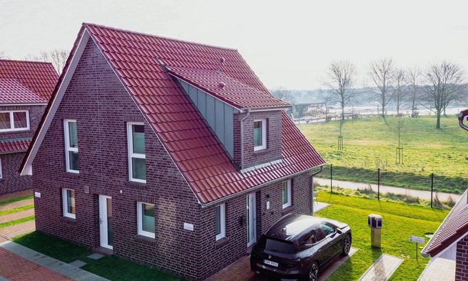Tannenhausen Casa | Ferienhaushälfte Wasserseite - Küsten Apartments Tannenhausen
