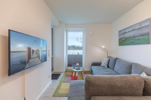 Norderhafen Apartamento | Ferienwohnung "Halligstork" direkt am Nordseedeich mit Blick auf den See