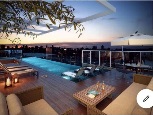 Setor Bueno Apartamento | FLAT DIFERENCIADO EM GOIÂNIA, SETOR BUENO, Ed DNA, SACADA PRIVATIVA DESCOBERTA COM JARDIM, PISCINA, ACADEMIA, GARAGEM, MINIMO 2 NOITES