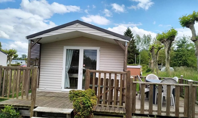 Martigny Casa | Flower Camping Des 2 Rivières *** - Mobile Home Comfort TV - 1 bedroom + semi-covered terrace - 2 to 4 people - 2 people. included in the price