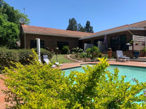 Lanseria Casa | Footprints Self Catering Indoor Heated Pool and Fireplaces