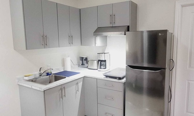 Kitchener Casa | Fully furnished Studio basement with bed, kitchen, laundry, living room with TV