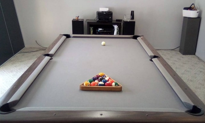 Southfield Casa | Fun House 2 with a Pool table on main floor game room with walk out patio door.