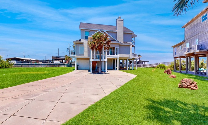 Indian Beach Casa | Galveston home with open floor, balcony, patio and water views