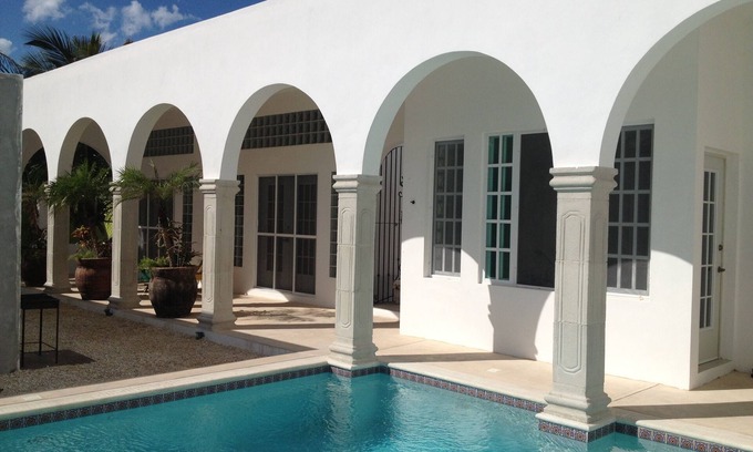 Chuburná Puerto Apartamento | Apartamento Las Palmeras Garden en Casa Solana Beachfront House