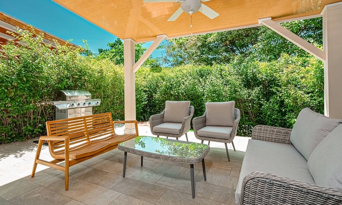Villarreal Condominio | Gated resort condo with on-site pool, outdoor areas, private patio, & W/D