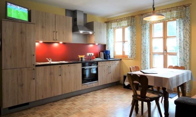 Ploessberg Apartamento | Acogedor apartamento con terraza amueblada y acceso al jardín.