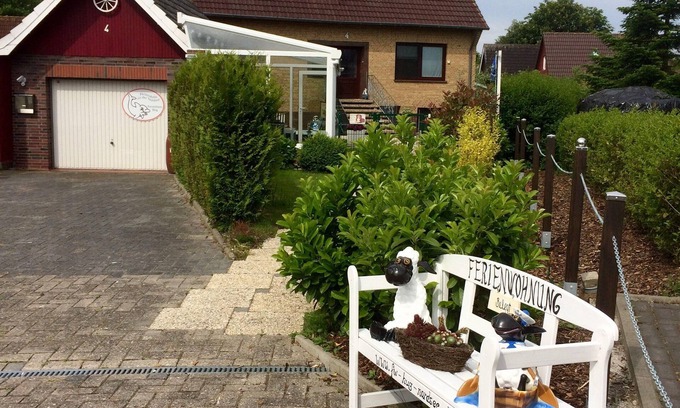 Carolinensiel Apartamento | Línea de oro nido de 4 palomas