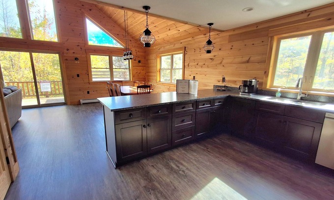 Carrabassett Valley Cabina | Gorgeous dog-friendly cabin with great view, deck, hot tub, & gas fireplace
