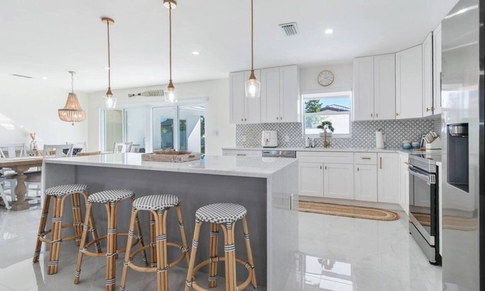 Garden Isles Casa | Gorgeous Waterfront Luxe Home w/ Heated Pool. Perfect Location!